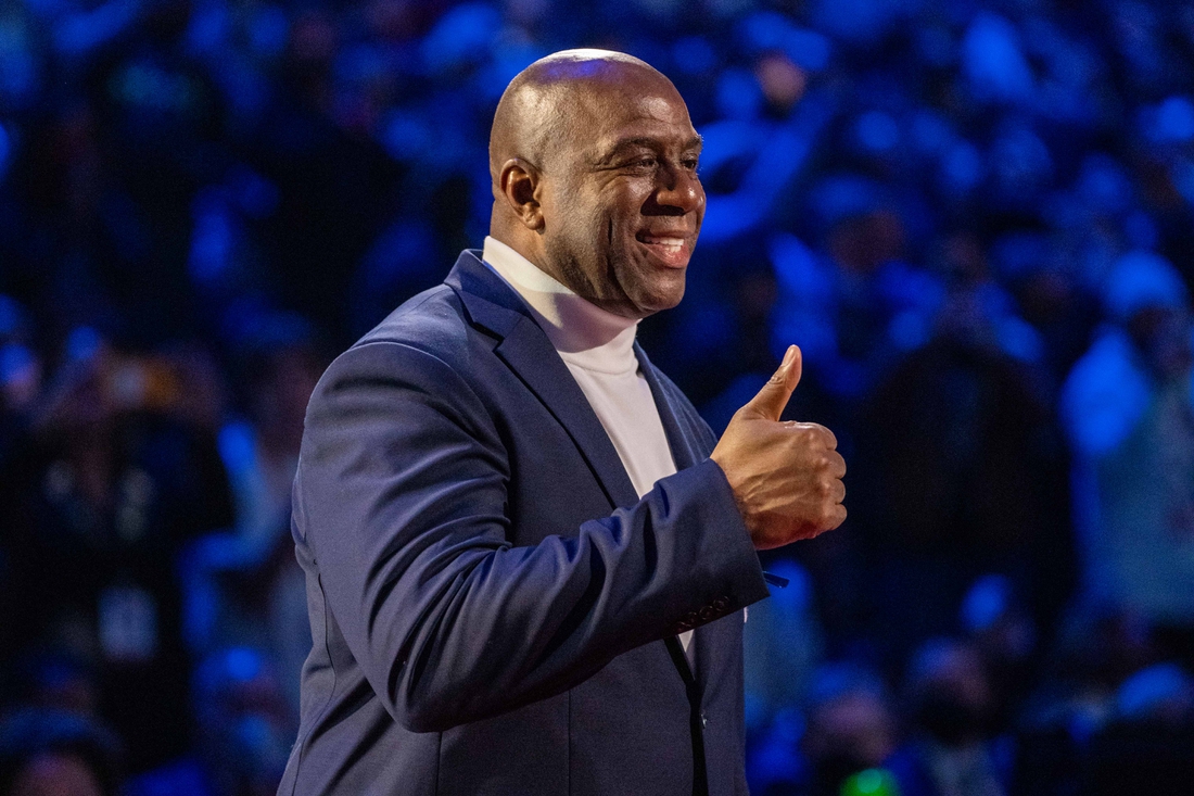 Report: Magic Johnson joins group bidding for Broncos